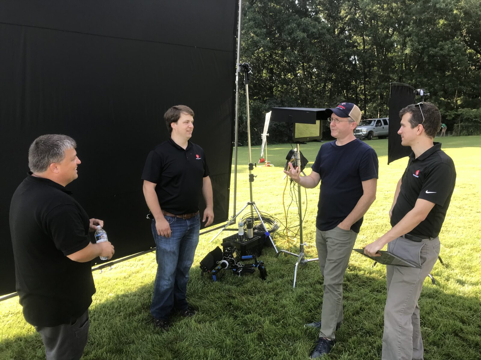Mark and the Production Team discussing the plan at a shoot